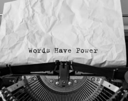 Text 'Words Have Power" typed on retro typewriter